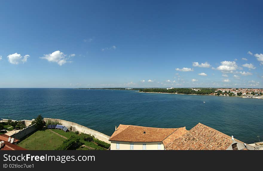 Panoramic landscape with the sky, the sea and roof