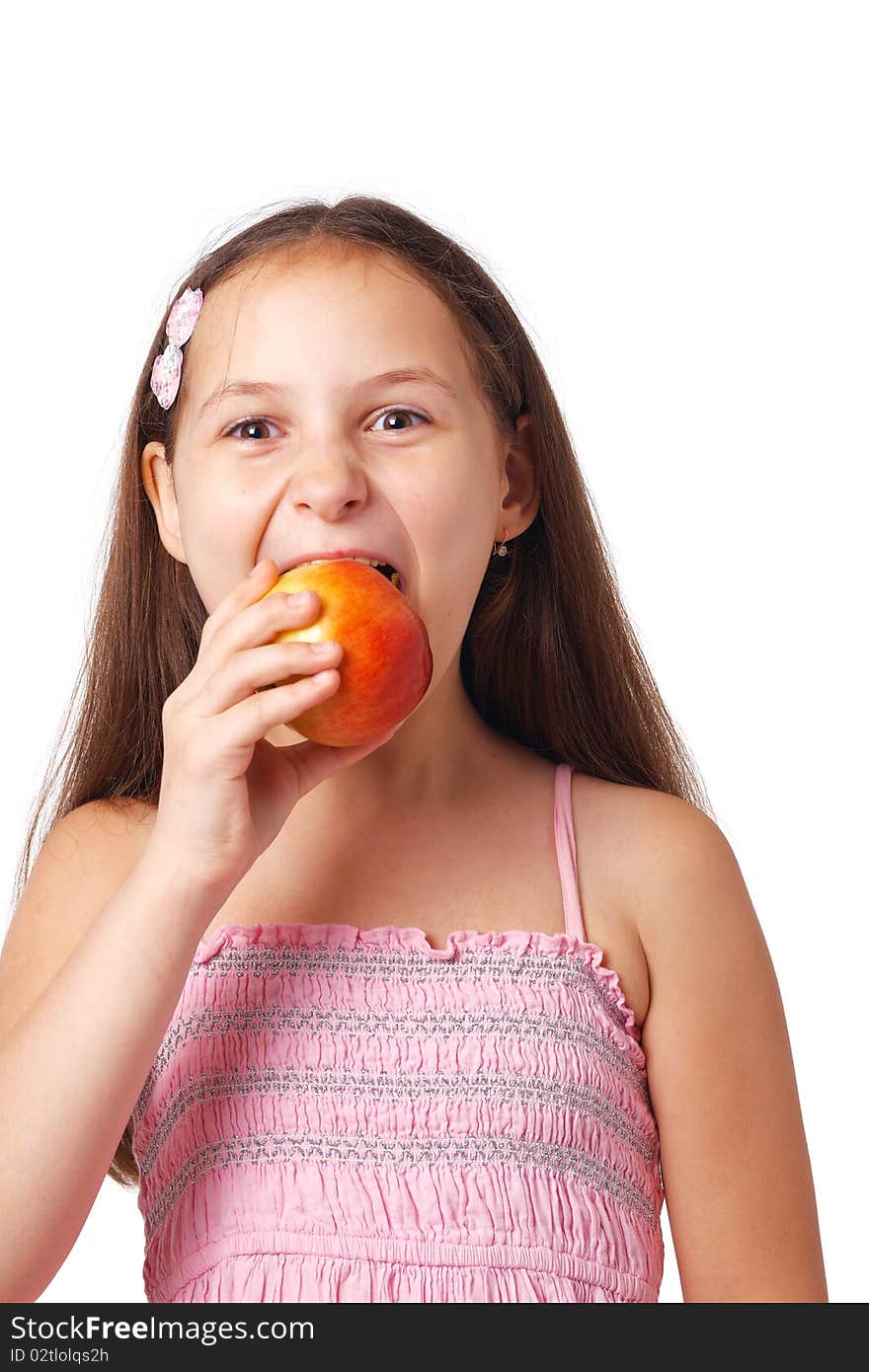 Nice little girl eating a delicious apple against white. Nice little girl eating a delicious apple against white.