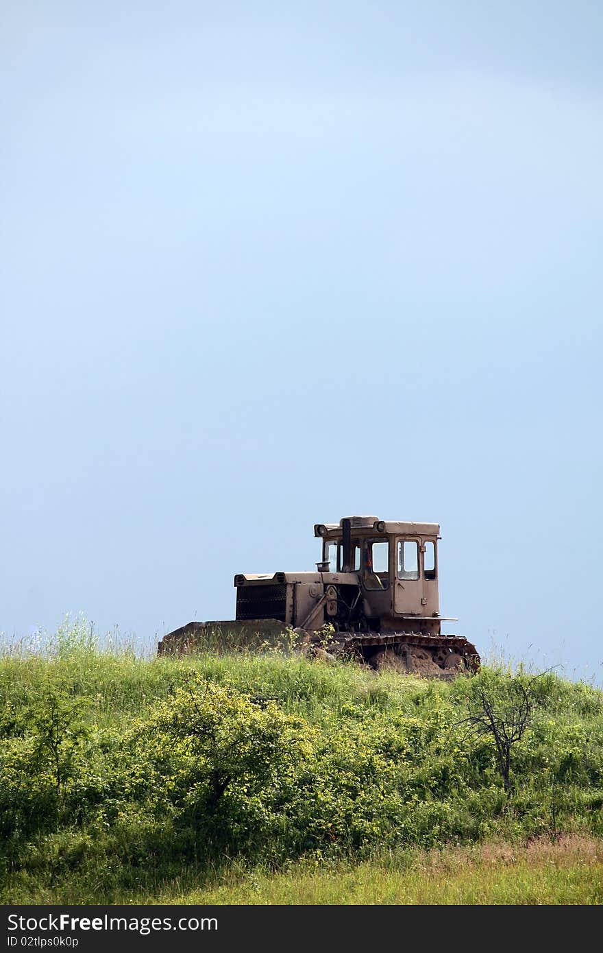 An old tractor in the meadow