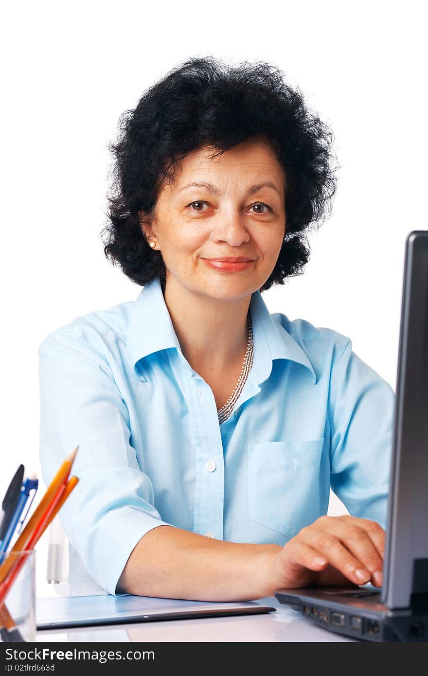 Elder woman using laptop on white background. Elder woman using laptop on white background.