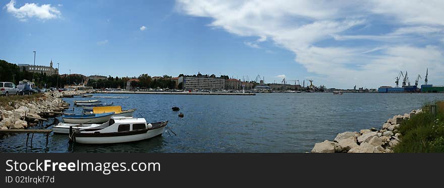 Panoramic landscape with the sky, the sea and the port city of Pula, Croatia