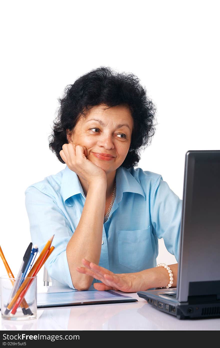 Elder woman looking on her laptop over white background. Elder woman looking on her laptop over white background.