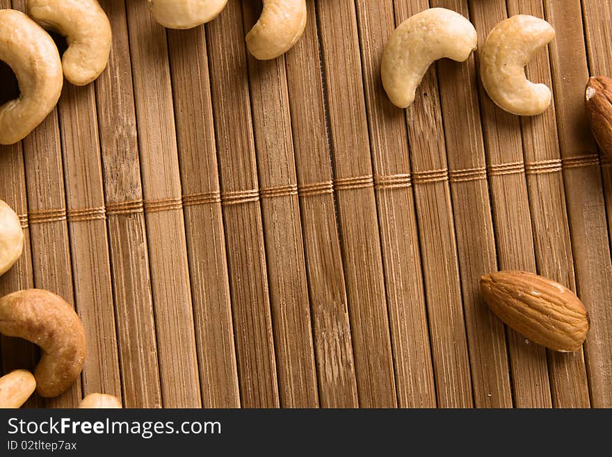 Nuts on bamboo background