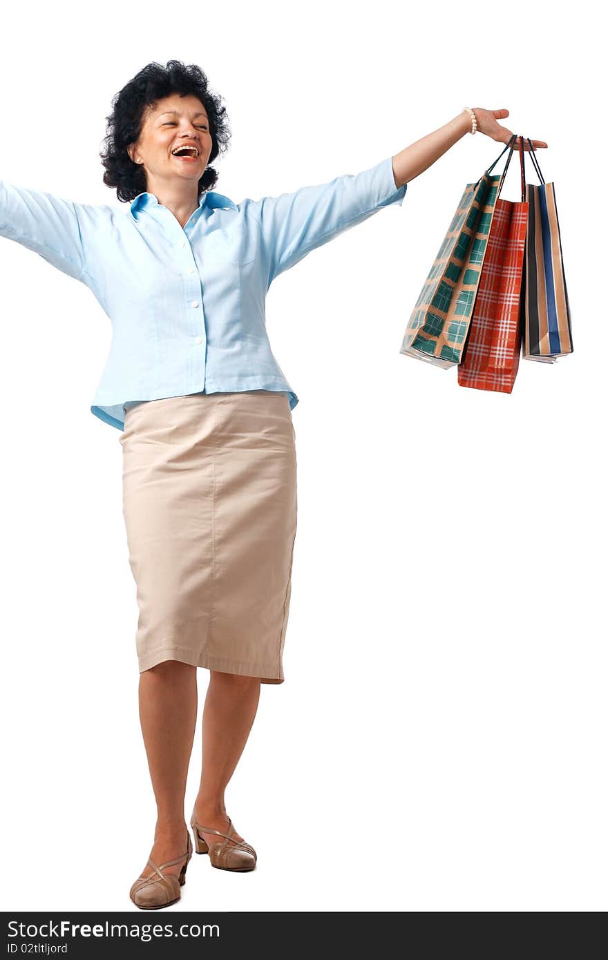 Senior Woman with shopping bags over white background. Senior Woman with shopping bags over white background.