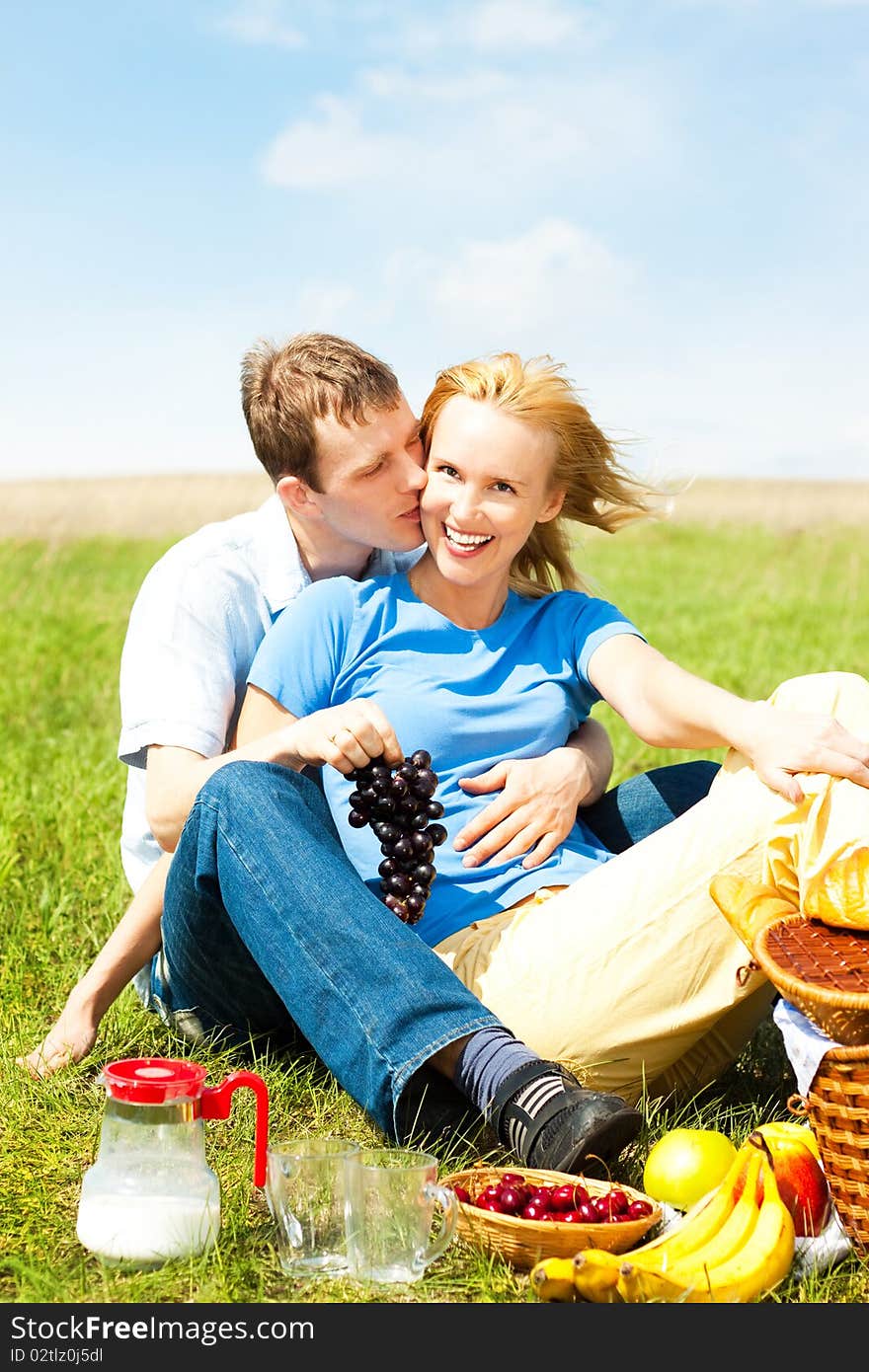 Beautiful happy family in nature, on a picnic;