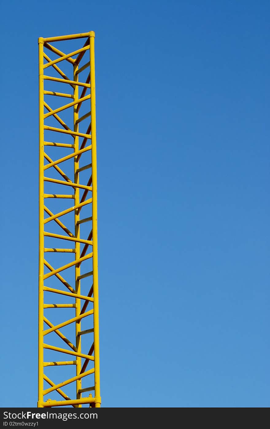 Abstract yellow metal construction over blue sky. Abstract yellow metal construction over blue sky