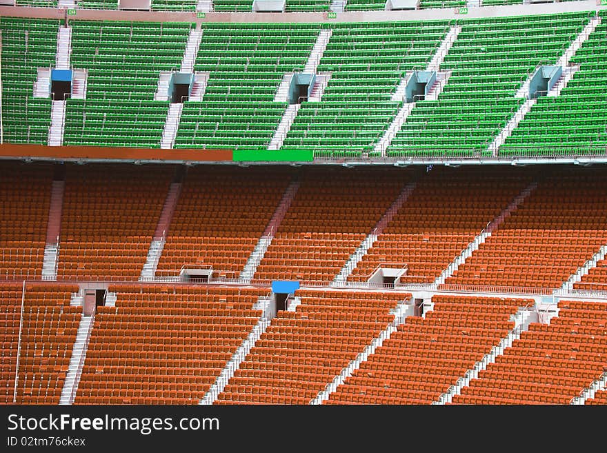 Colored chairs in a football stadium. Colored chairs in a football stadium