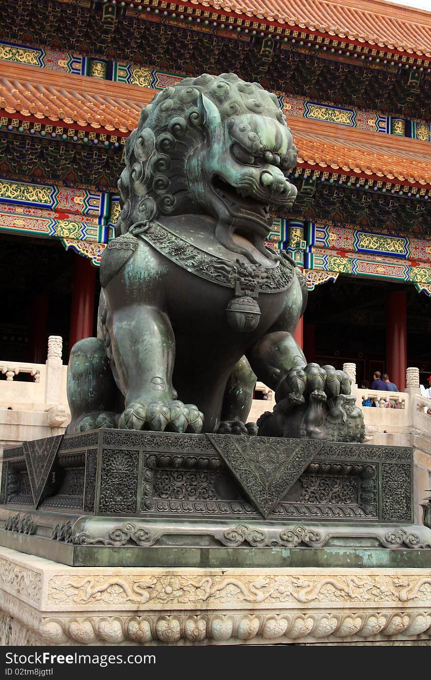 Forbidden City in Beijing Bronze lion at entrance of The Forbidden City in Beijing, China.