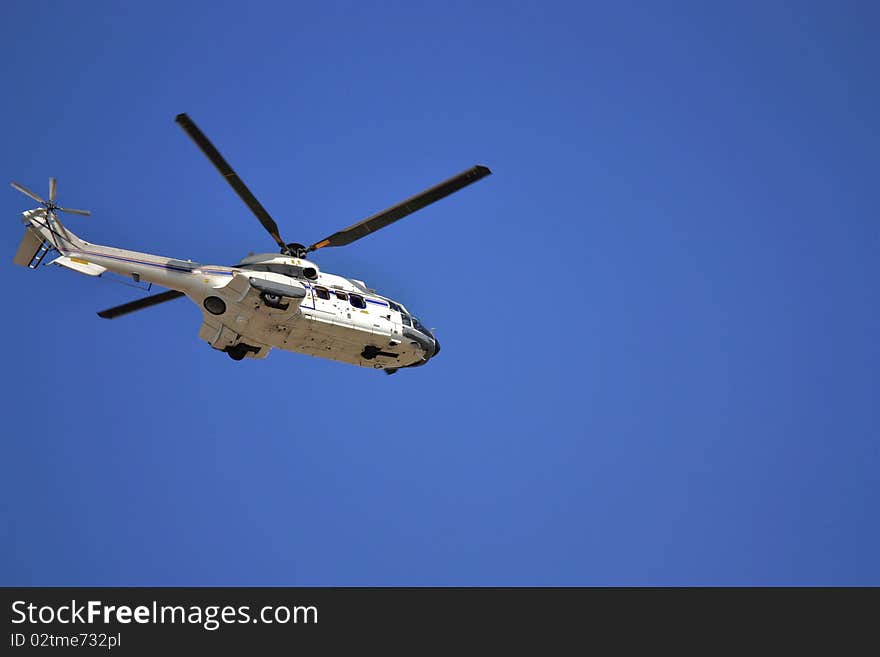 A Eurocopter AS532 helicopter shot from beneath with a fast shutter setting. A Eurocopter AS532 helicopter shot from beneath with a fast shutter setting.