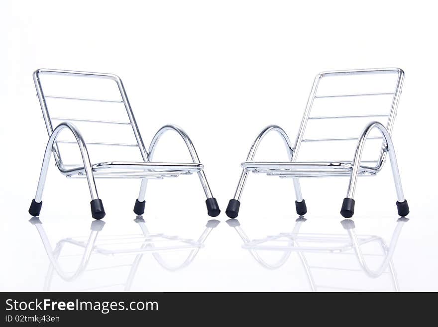 Close up of silver steel chair isolated on white background.