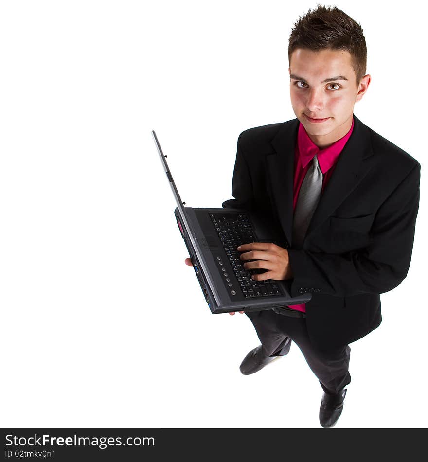 Young teenage businessman with laptop over isolated white background. Fresh young man with pink shirt.