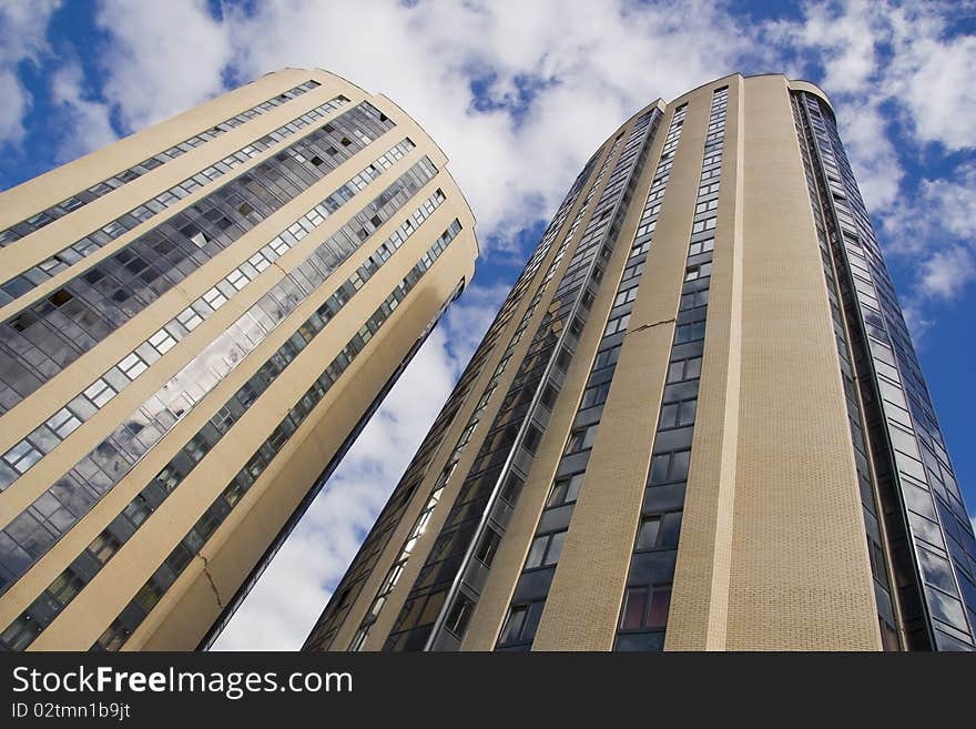 Modern office building against the blue sky with clouds, Russia. Modern office building against the blue sky with clouds, Russia