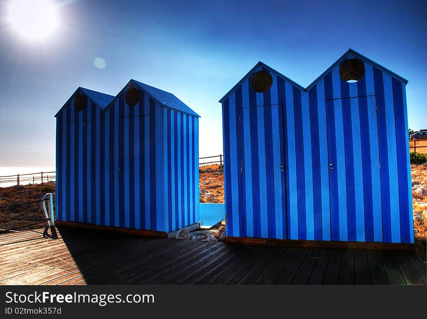 Two couples of Blue Old Style Beach Huts