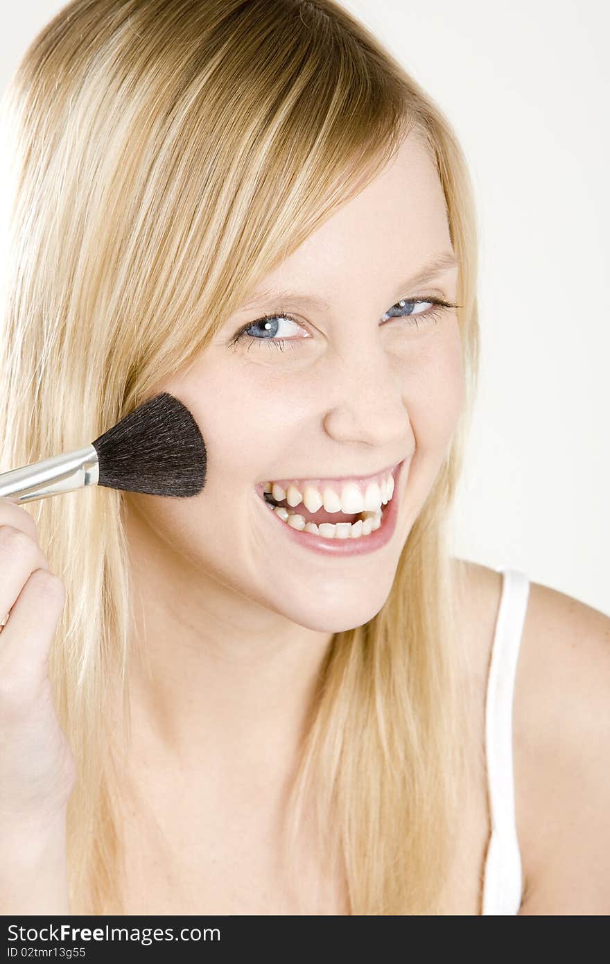 Portrait of smiling young woman with a brush. Portrait of smiling young woman with a brush