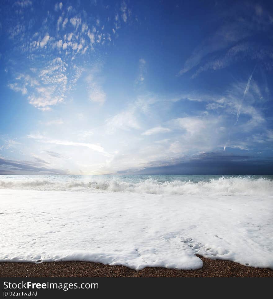 Gorgeous Beach in Summertime, Storm clouds with sun over sea