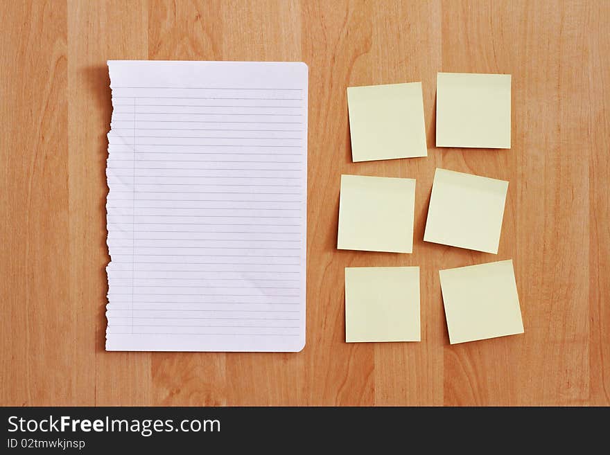 Blank stationery on wooden wall