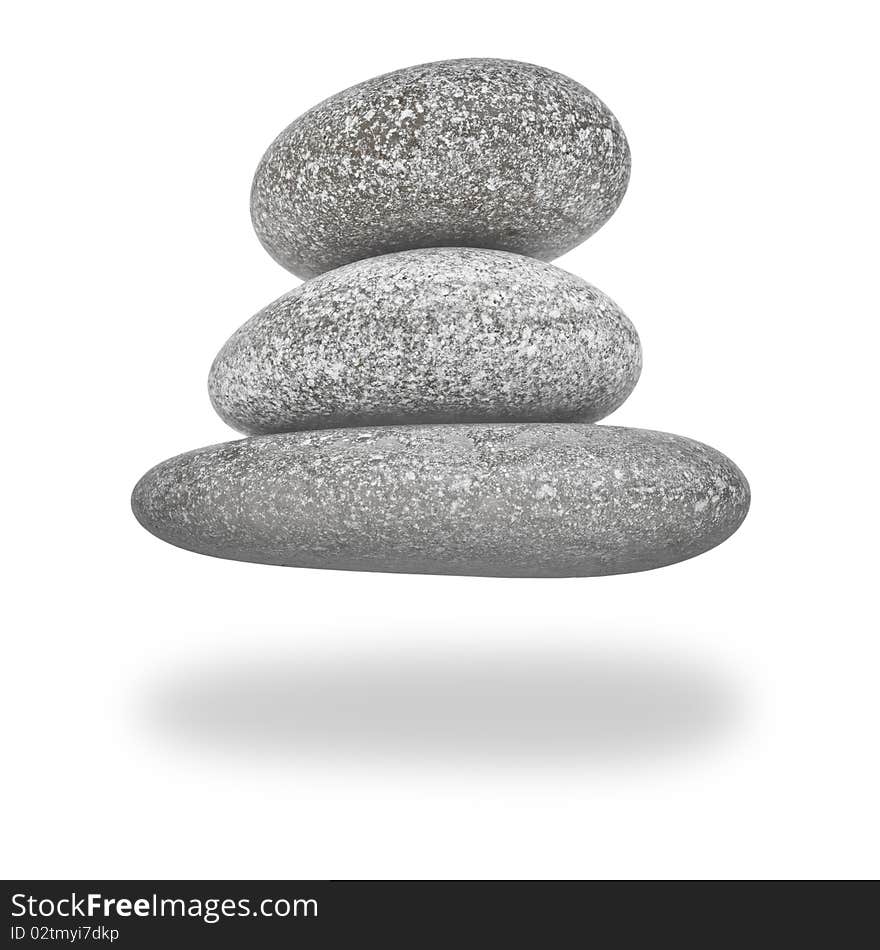 Levitation Pyramid of Stones. Backlit. Isolated on white. With Clipping Path.