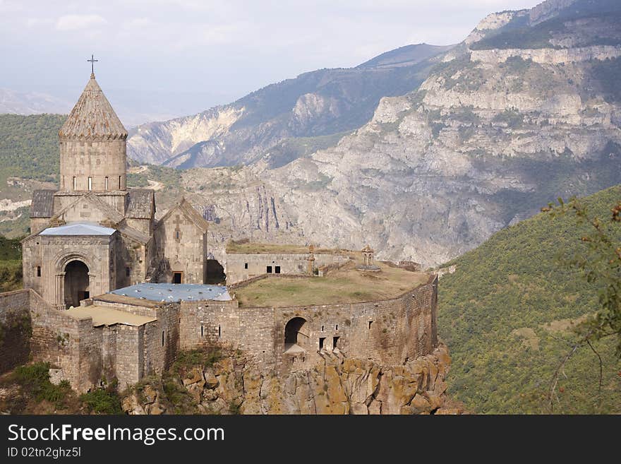 The Tatev monastery, Armenia, about IX century, big building is church of st. Poghos and Petros, about X century, monastery is above the river Vorotans canyon, in thick walls is monks cells and another rooms. The Tatev monastery, Armenia, about IX century, big building is church of st. Poghos and Petros, about X century, monastery is above the river Vorotans canyon, in thick walls is monks cells and another rooms.