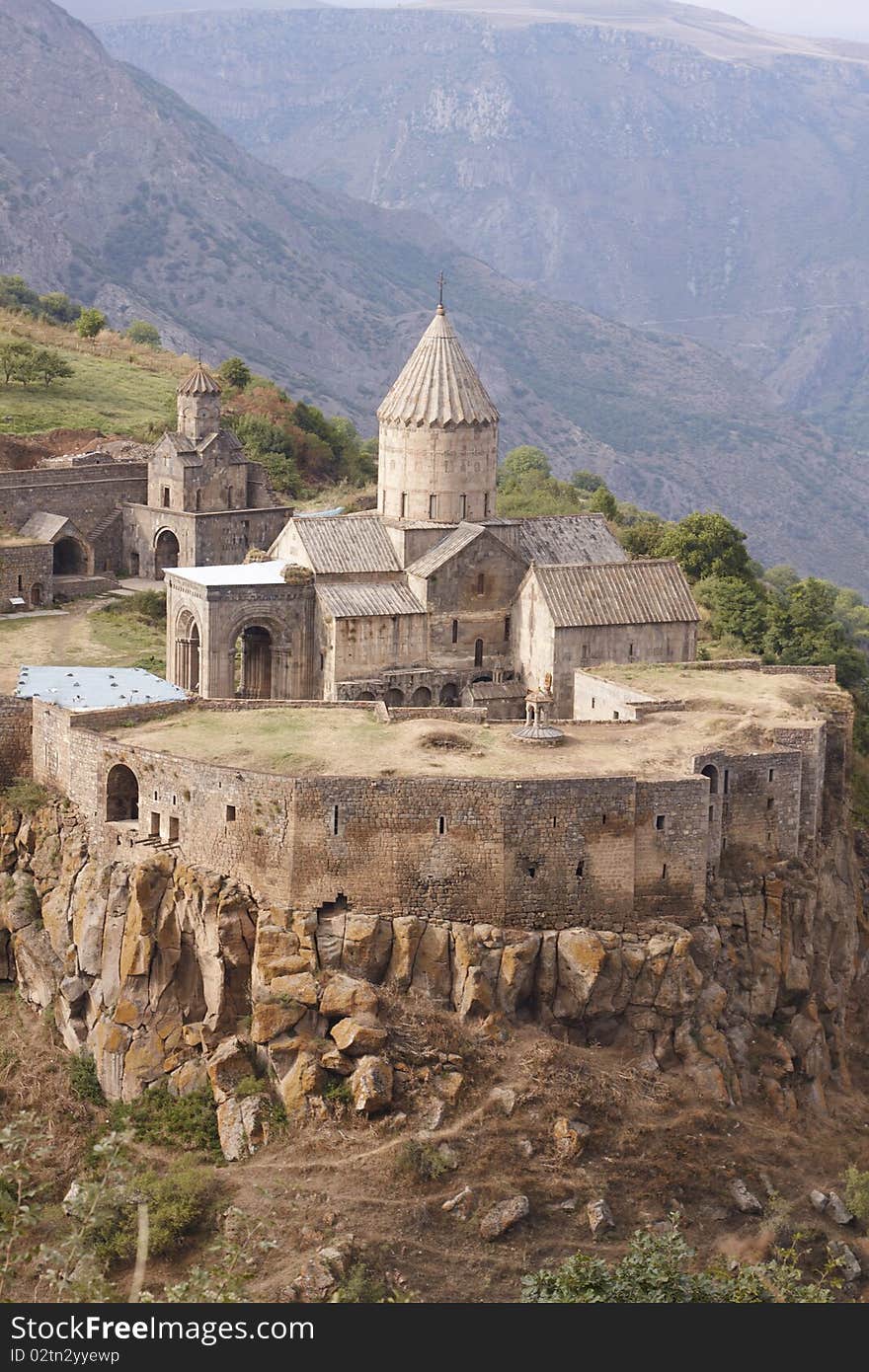 The Tatev monastery, Armenia, about IX century, big building is church of st. Poghos and Petros, about X century, monastery is above the river Vorotans canyon, in thick walls is monks cells and another rooms,. The Tatev monastery, Armenia, about IX century, big building is church of st. Poghos and Petros, about X century, monastery is above the river Vorotans canyon, in thick walls is monks cells and another rooms,