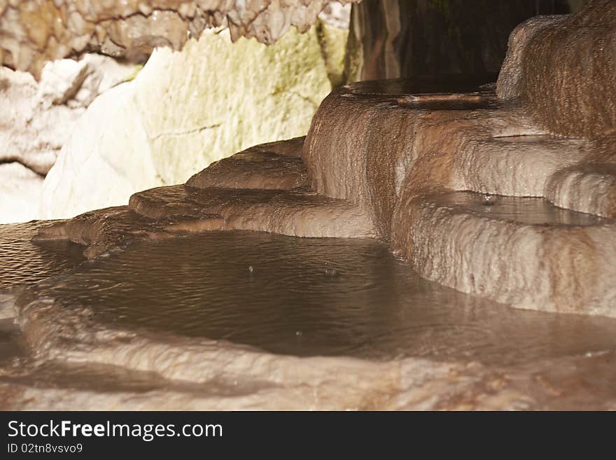 Stalactite formations in the cave with natural hot water, under Brige of Diabolo near Tatev monastery, Armenia. Stalactite formations in the cave with natural hot water, under Brige of Diabolo near Tatev monastery, Armenia