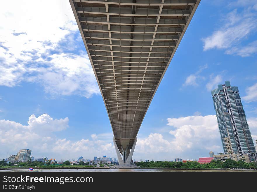 Under the suspension bridge of industrial ring road with brighten sky view. Under the suspension bridge of industrial ring road with brighten sky view