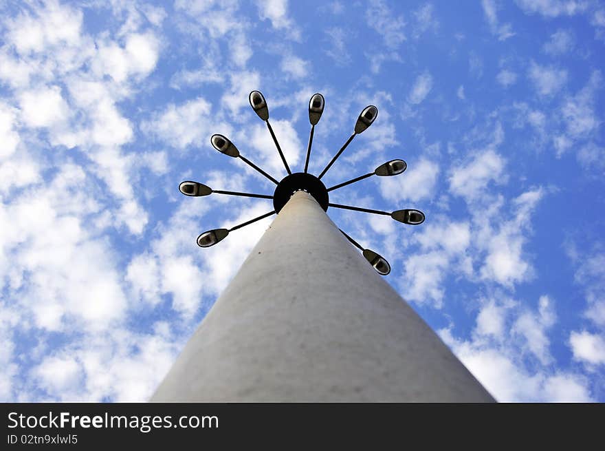 Street light on blue sky with clouds