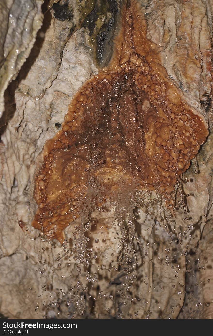 Stalactite formations in the cave with natural hot water, under Brige of Diabolo near Tatev monastery, Armenia. Stalactite formations in the cave with natural hot water, under Brige of Diabolo near Tatev monastery, Armenia