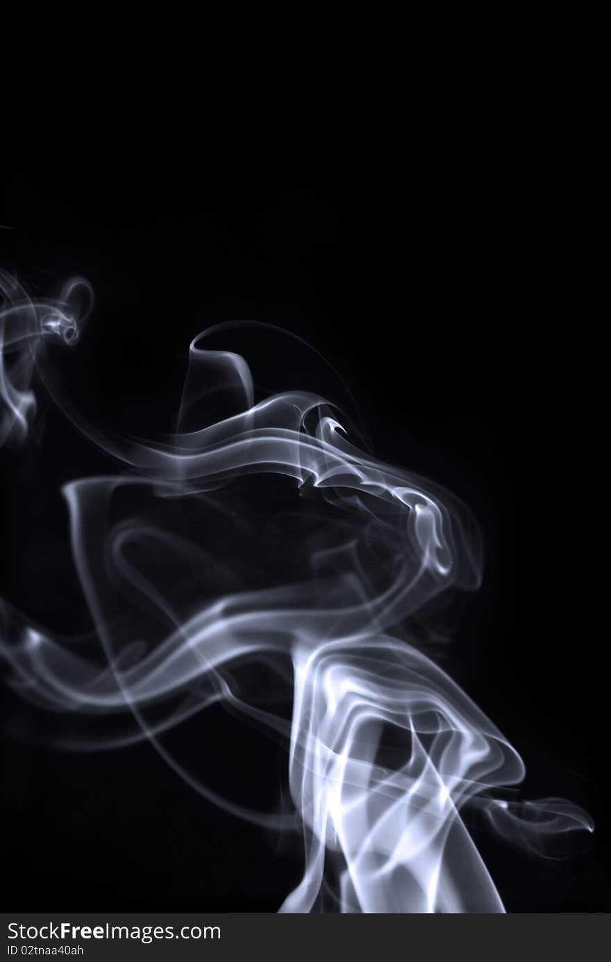 White twisting smoke isolated on black background