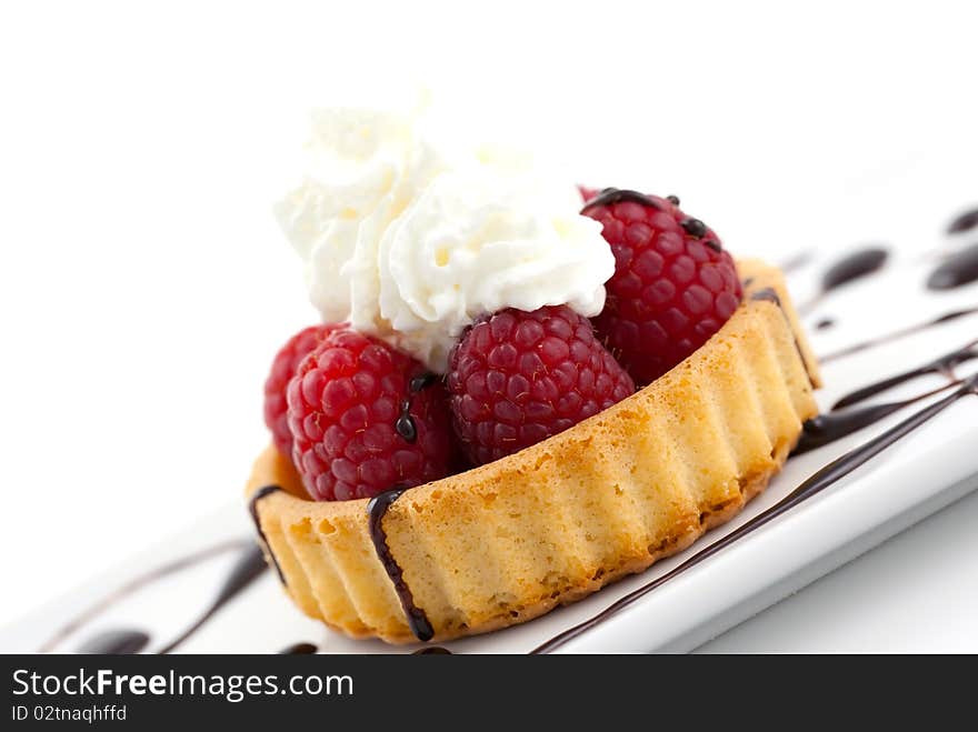 Cake with raspberry and whipped cream