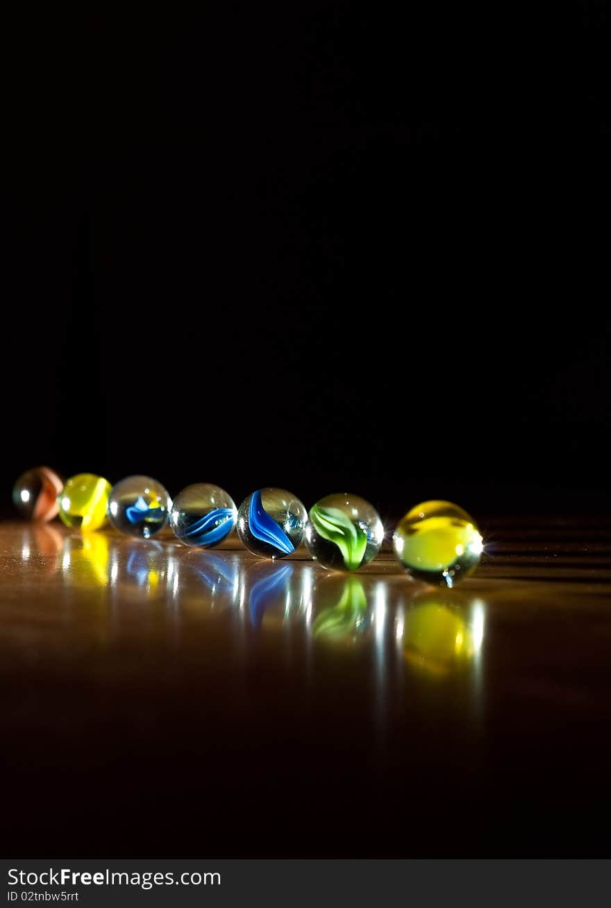 Row of Marbles in One-Point Lighting Background. Row of Marbles in One-Point Lighting Background