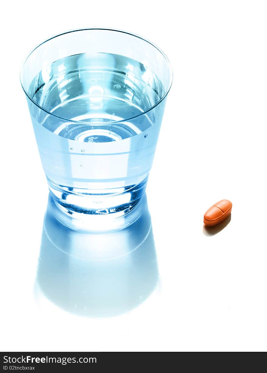 Pill and glass of pure water. Pill and glass of pure water