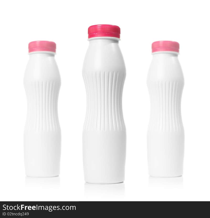 Picture of three blank plastic bottles over white. Depth of field effect