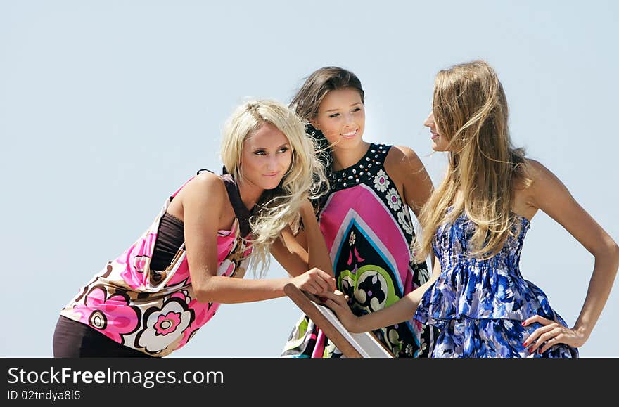 Three young beautiful girls outdoors