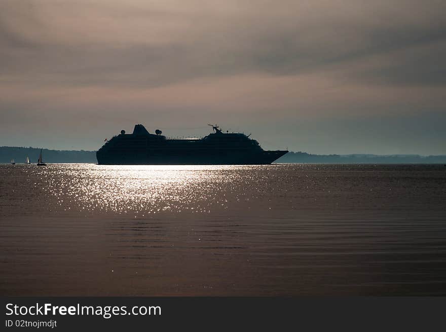 Cruise ship sailing on a summer evening. Cruise ship sailing on a summer evening