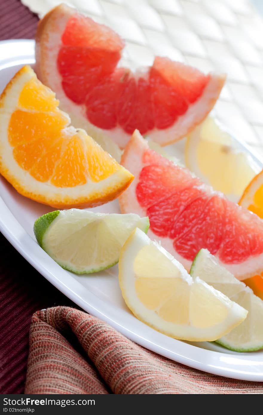 Arrangement of lemon, lime, tangerine, orange and grapefruit fruit. Arrangement of lemon, lime, tangerine, orange and grapefruit fruit