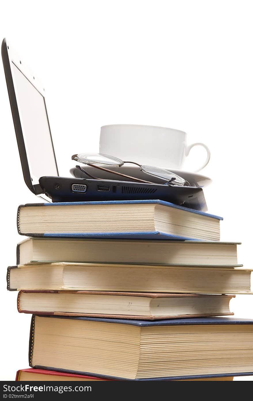 Books and laptop  isolated on the white background