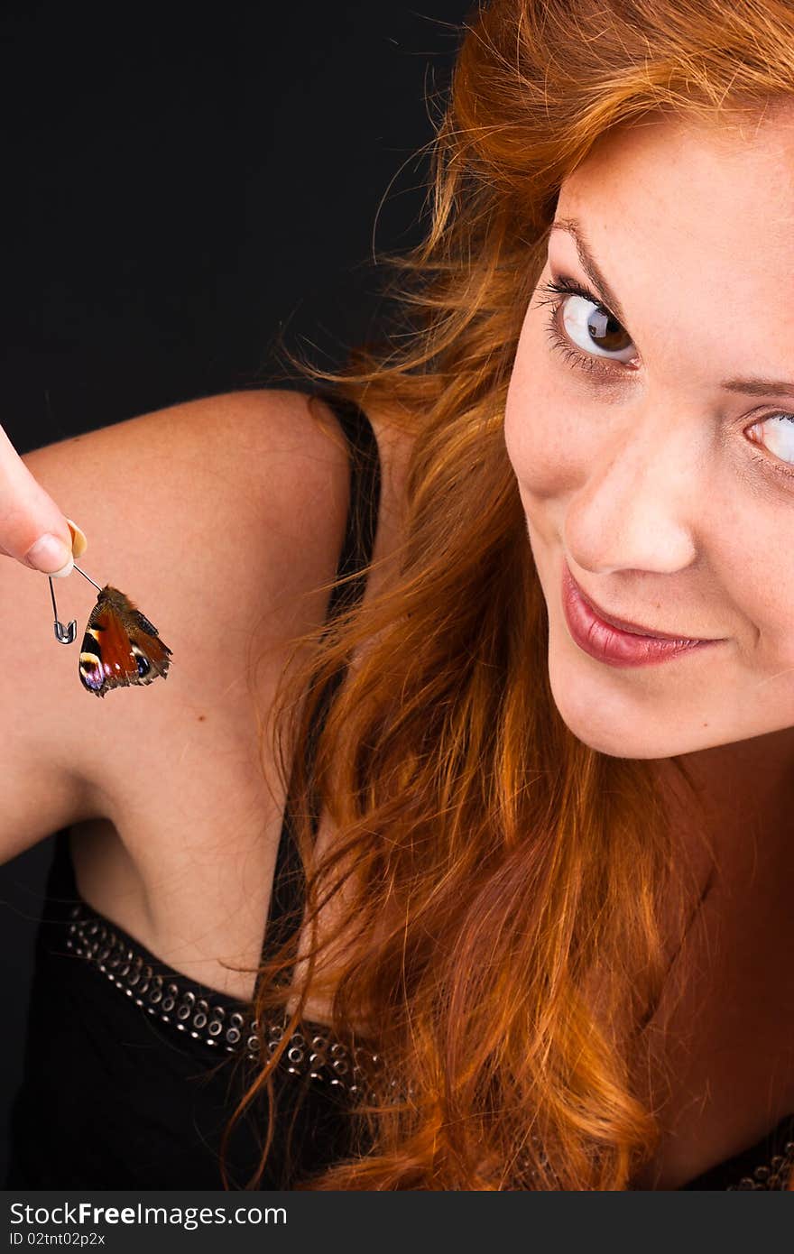 Portrait of beautiful red=haired woman closeup with butterfly. Portrait of beautiful red=haired woman closeup with butterfly