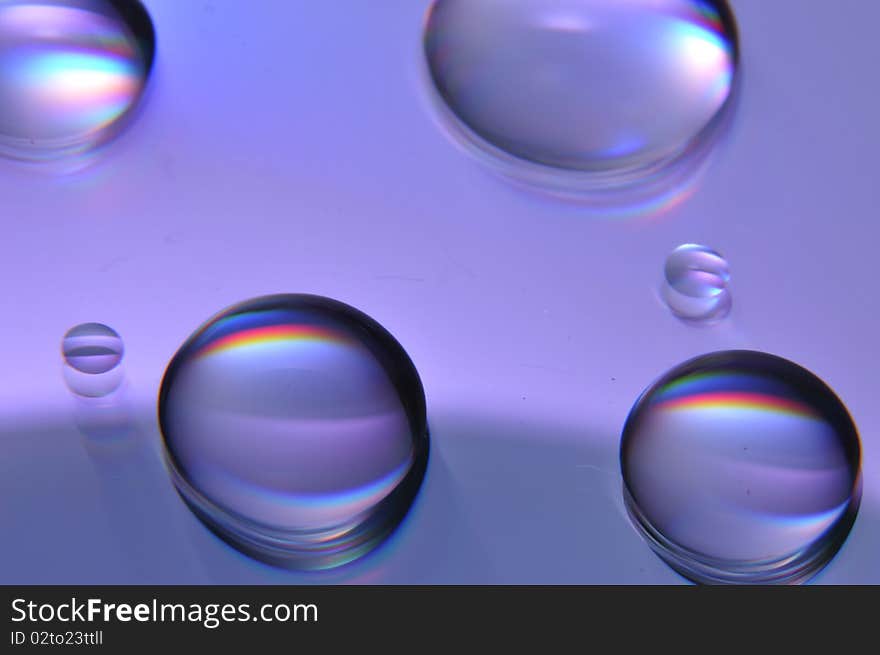 These are some water drops on a DVD. These are some water drops on a DVD