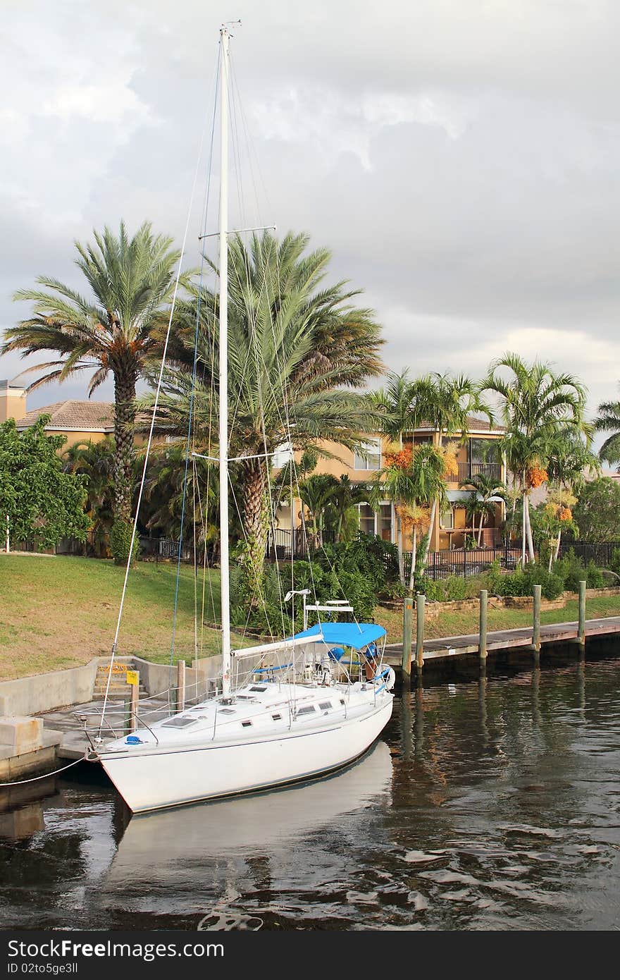 Sailboat Moored In Waterway