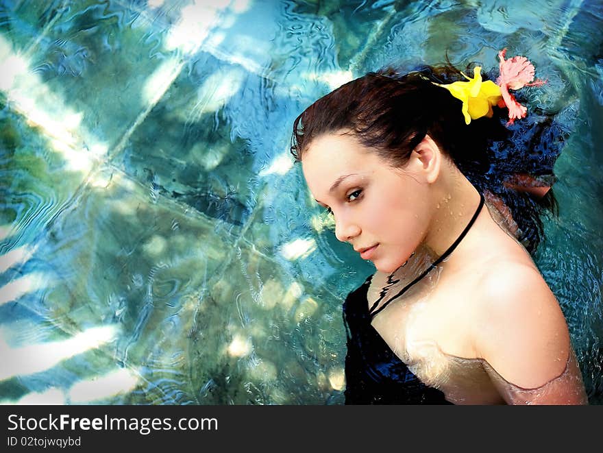 Beautiful young woman on the water surface. Beautiful young woman on the water surface