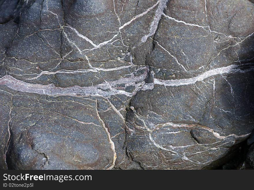 Structure of the stone laying on coast of the river. Russia. Kamchatka. Structure of the stone laying on coast of the river. Russia. Kamchatka.