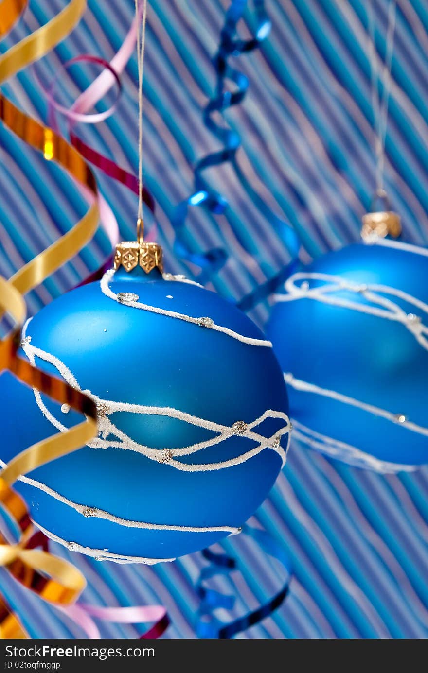 Christmas decoration from two blue balls on blue background