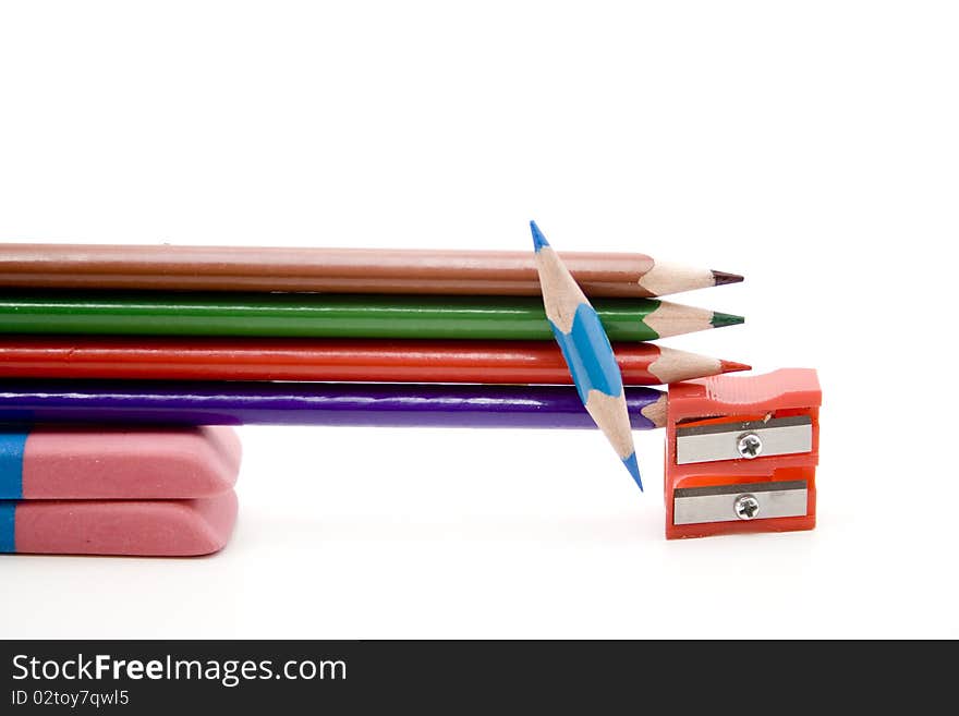 Colored pencils with plastic sharpeners and erasers. Colored pencils with plastic sharpeners and erasers