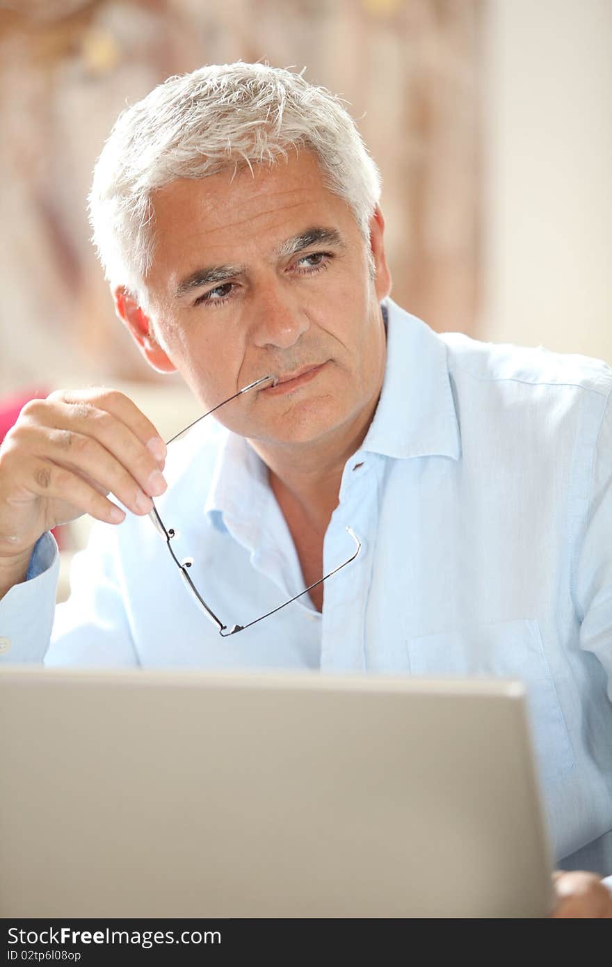 Man in front of laptop computer. Man in front of laptop computer