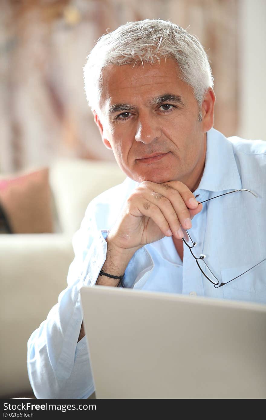 Man in front of laptop computer. Man in front of laptop computer