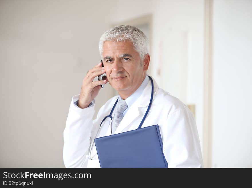 Portrait of doctor standing in hall. Portrait of doctor standing in hall