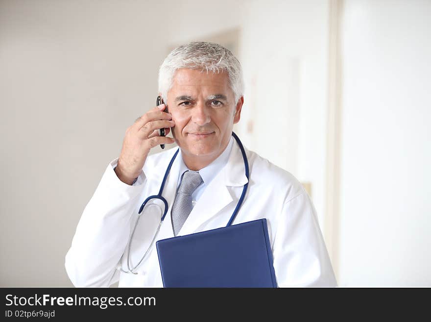 Portrait of doctor standing in hall. Portrait of doctor standing in hall