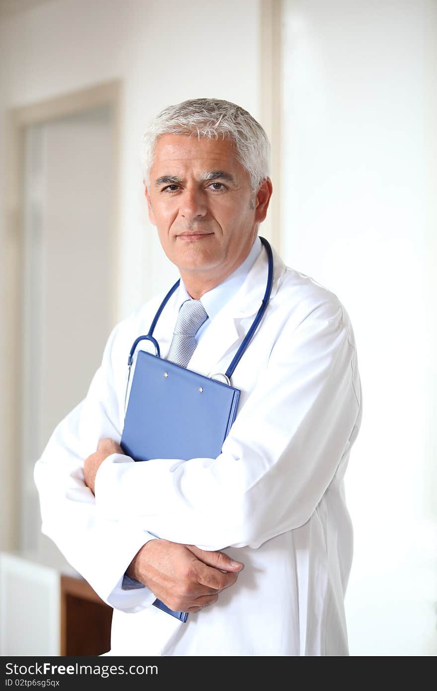 Portrait of doctor standing in hall. Portrait of doctor standing in hall