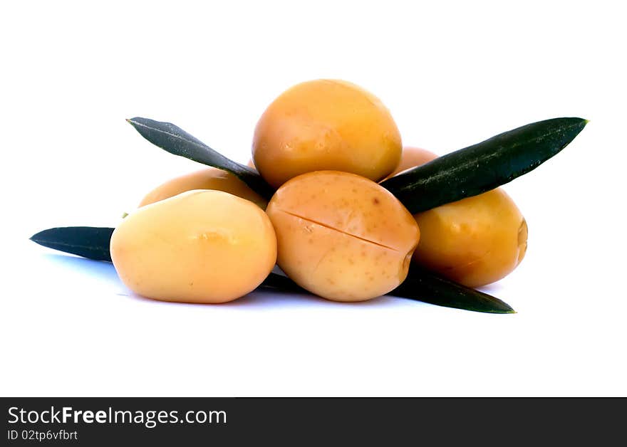 Green olives with leaves isolated on white background