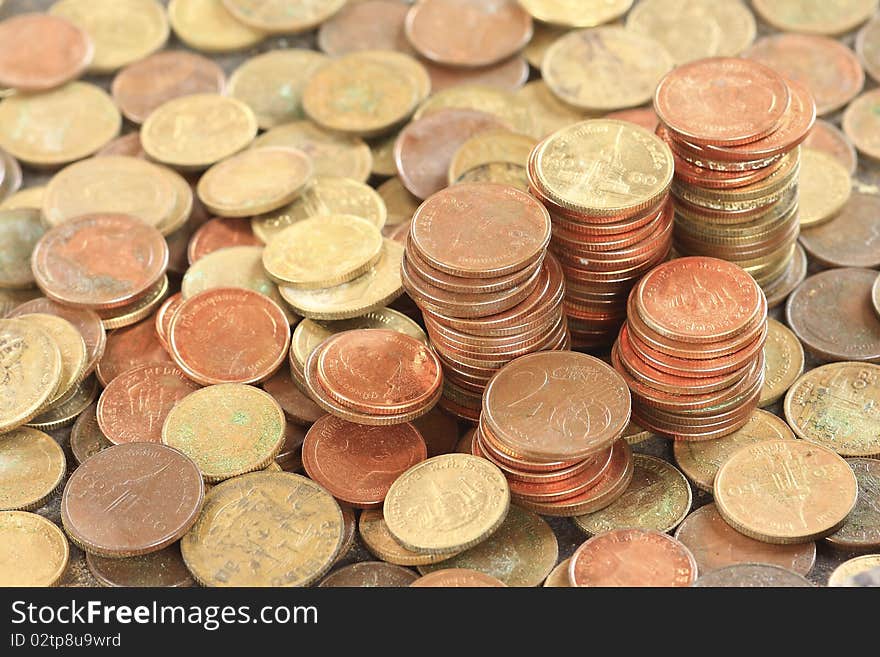 Lots of coins dropped on flat surface - flat view, texture of coins. Lots of coins dropped on flat surface - flat view, texture of coins